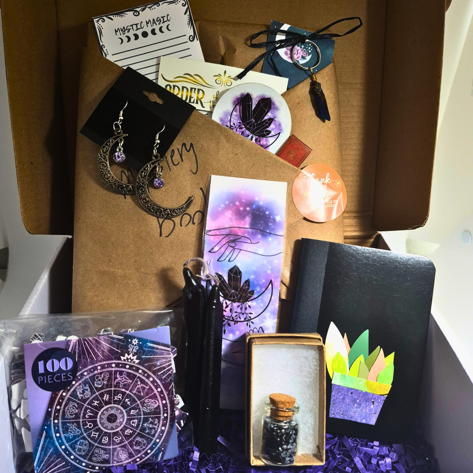 Mystic Magic Bookish Box front view – blind YA fantasy novel with witchy moon earrings, crystal keychain, bookmark